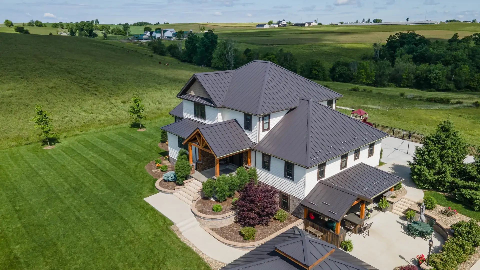 home with metal roof in country